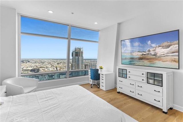 bedroom with light hardwood / wood-style floors