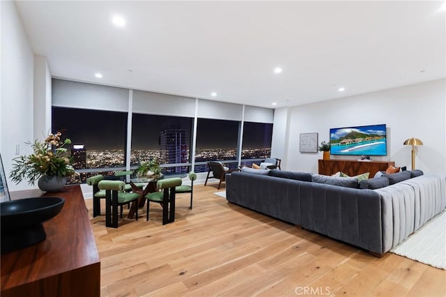 living area with recessed lighting and light wood-type flooring