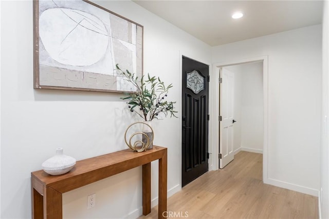 foyer entrance with light hardwood / wood-style floors