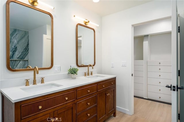 bathroom with vanity and hardwood / wood-style flooring