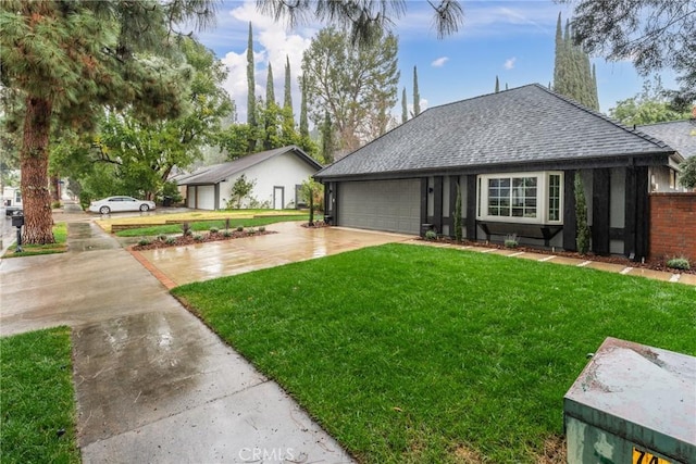 view of front of home with a garage and a front yard