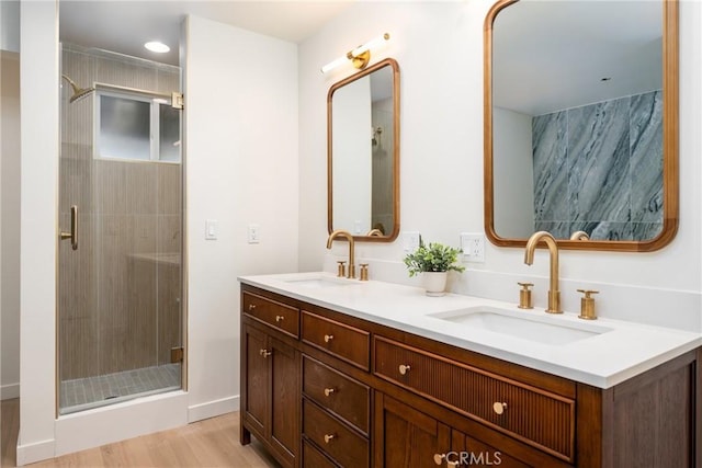 bathroom featuring vanity, hardwood / wood-style floors, and an enclosed shower