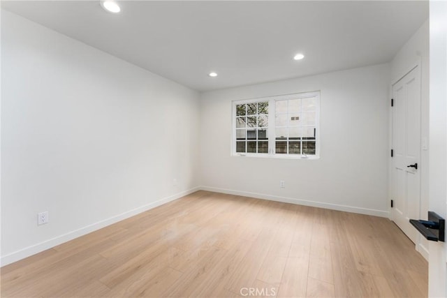 spare room featuring light hardwood / wood-style flooring