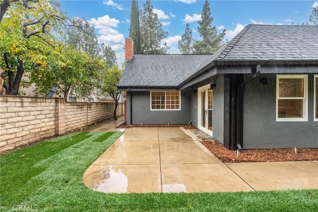 back of property featuring a patio area