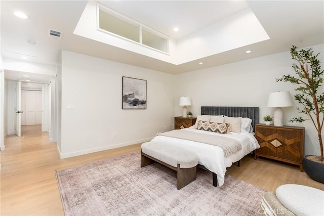 bedroom with hardwood / wood-style flooring