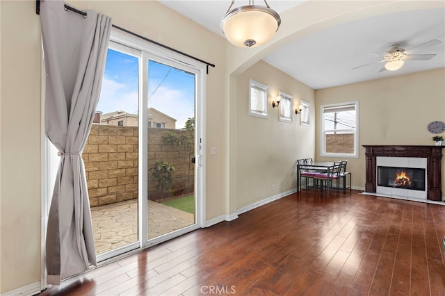 entryway featuring dark wood-type flooring and ceiling fan