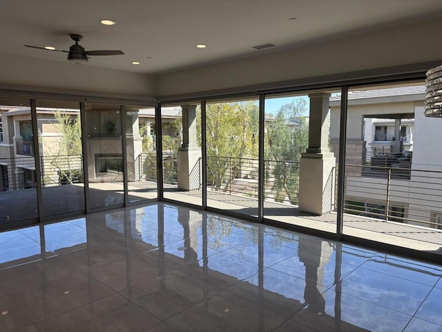 interior space featuring ceiling fan