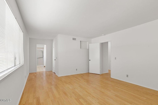 empty room with light wood-type flooring