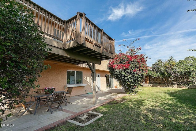 view of yard with a deck and a patio area