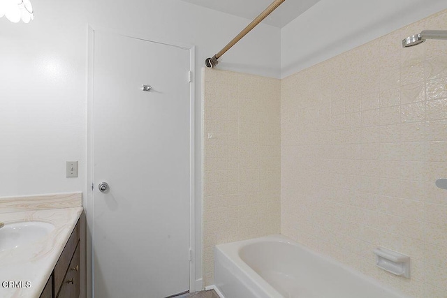 bathroom featuring vanity and tiled shower / bath combo