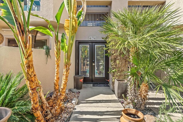 view of exterior entry featuring french doors