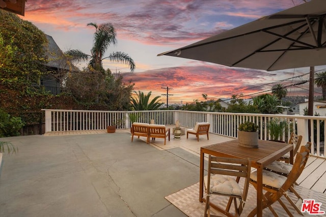 patio terrace at dusk with an outdoor hangout area