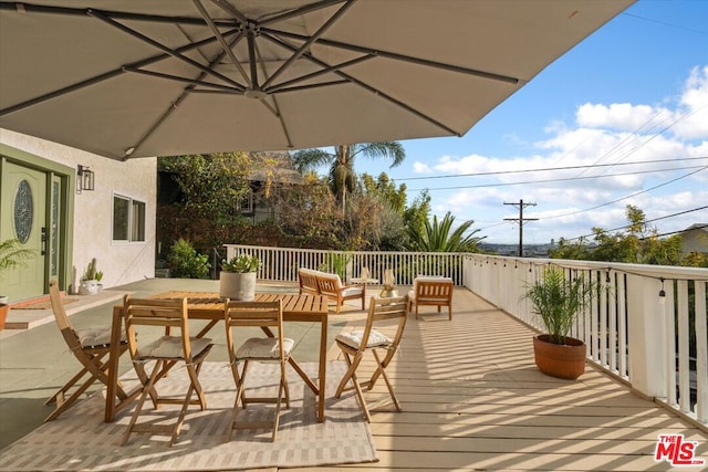 wooden terrace with outdoor lounge area