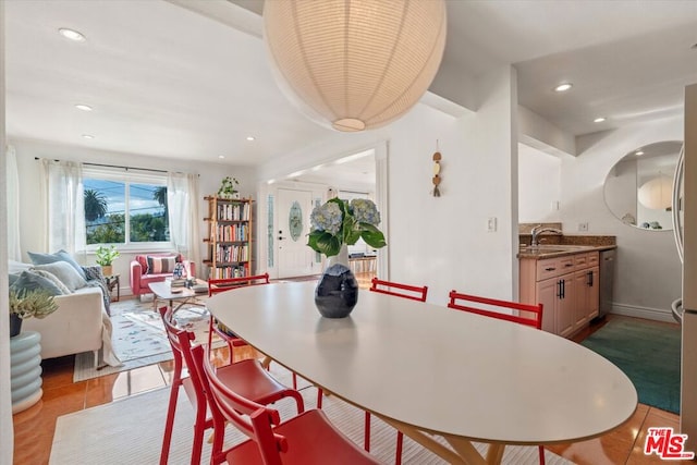 dining room featuring sink