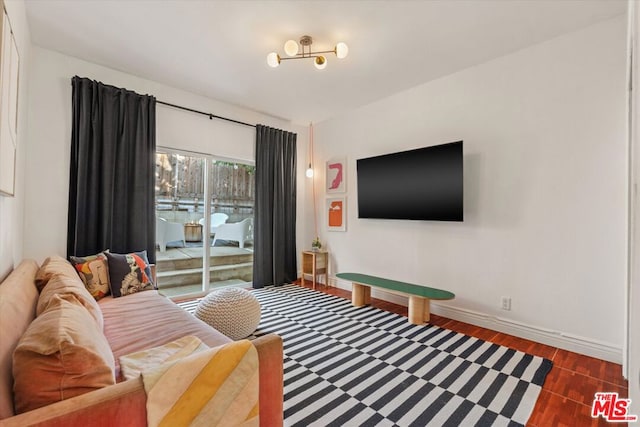 living room with dark hardwood / wood-style flooring