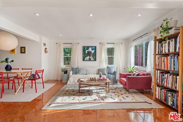 living room with a healthy amount of sunlight and light tile patterned floors