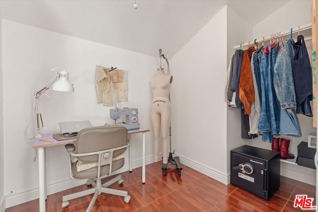 home office featuring dark hardwood / wood-style flooring and lofted ceiling