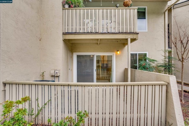 property entrance with a balcony