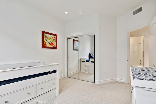 carpeted bedroom featuring a closet