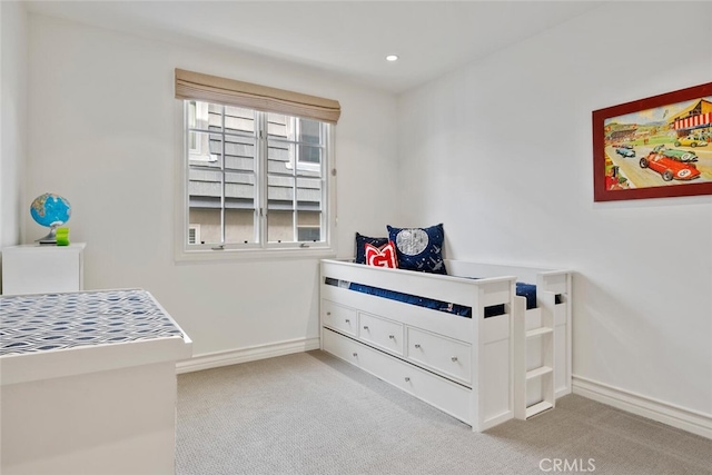 bedroom with light colored carpet