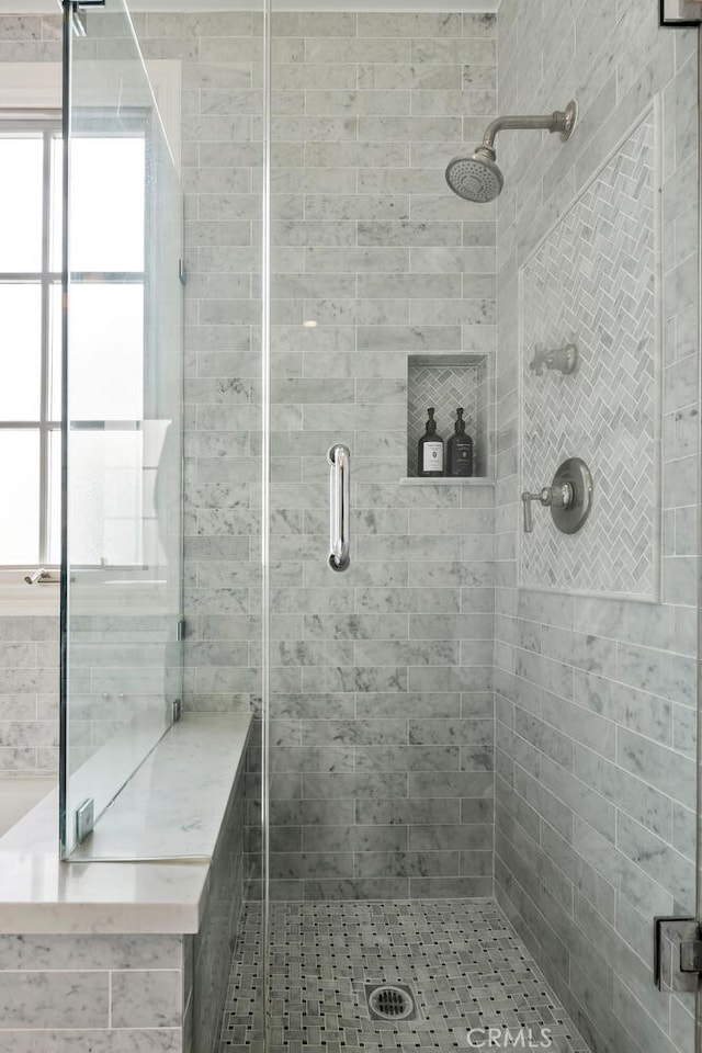 bathroom with an enclosed shower