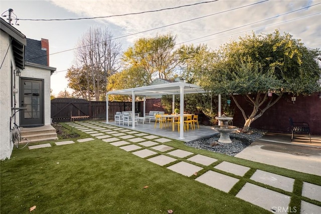 view of yard with a pergola and a patio