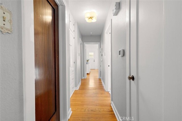 hallway featuring light wood-type flooring