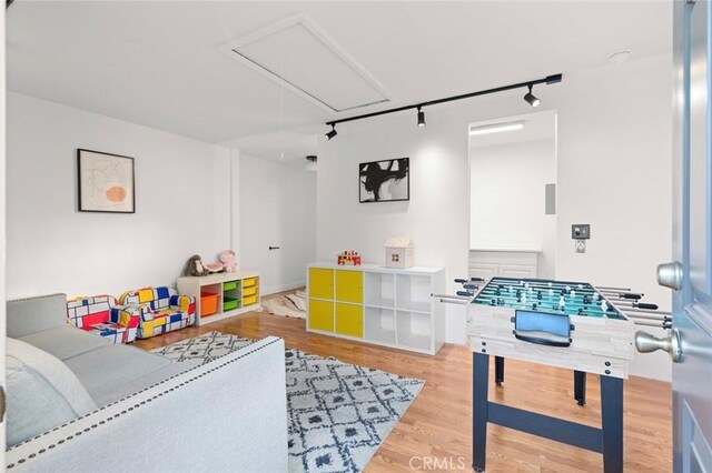 playroom with hardwood / wood-style flooring