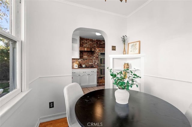 dining area with crown molding