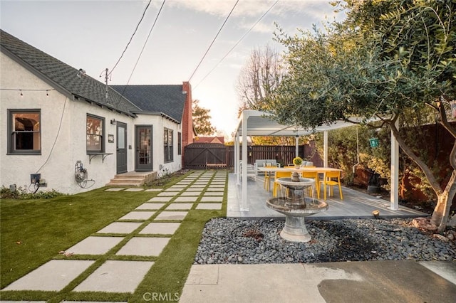 view of yard featuring fence and a gate