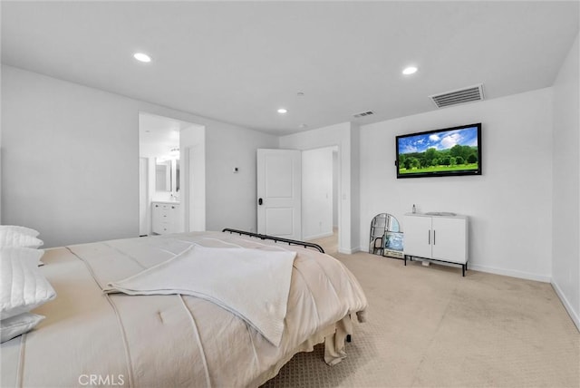 carpeted bedroom with baseboards, ensuite bath, visible vents, and recessed lighting