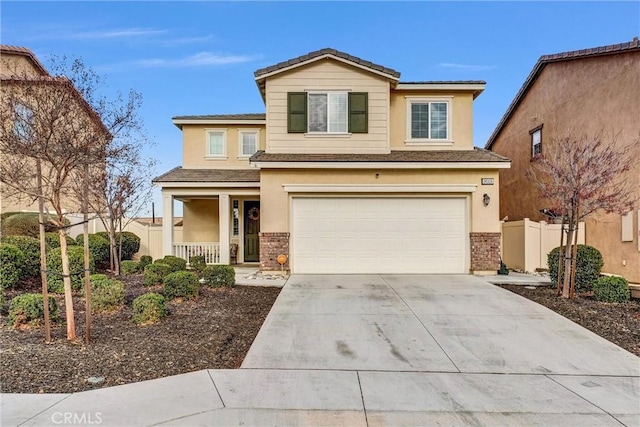 view of front of home featuring covered porch, a garage, fence, driveway, and stucco siding