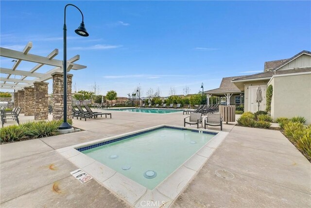 view of pool featuring a pergola and a patio