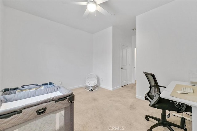 carpeted bedroom featuring ceiling fan and baseboards