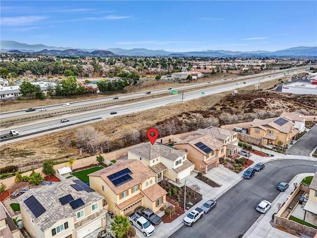 birds eye view of property featuring a mountain view