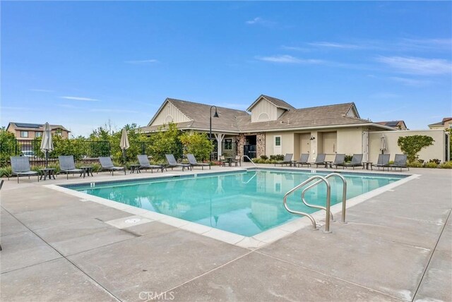 view of swimming pool with a patio area