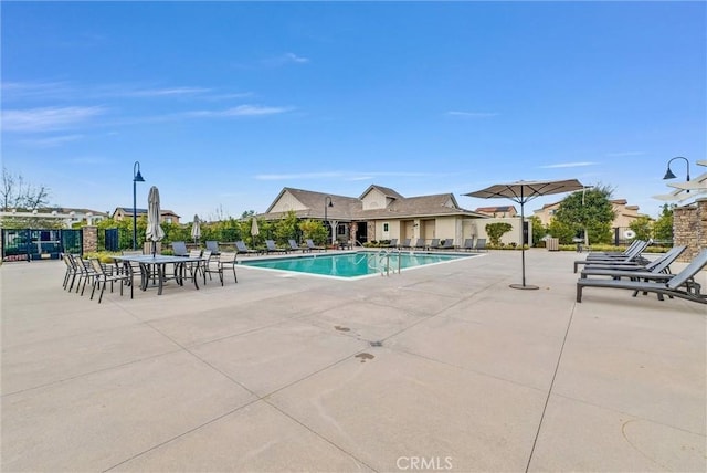 pool featuring a patio area