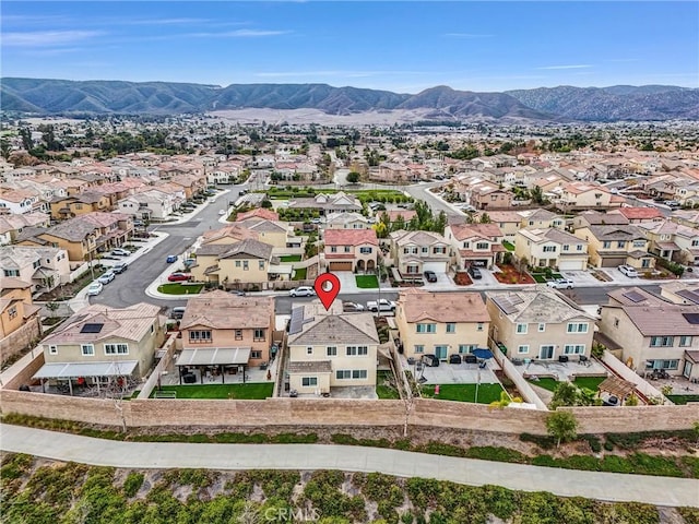 birds eye view of property with a mountain view and a residential view