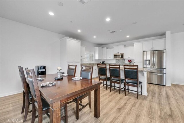 dining area featuring light hardwood / wood-style floors