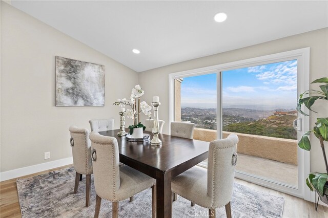 31002 Flying Cloud Dr, Laguna Niguel, CA 92677 - dining space with light wood-style floors, vaulted ceiling, and recessed lighting