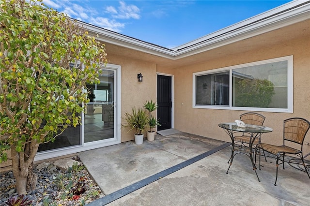 property entrance with a patio area