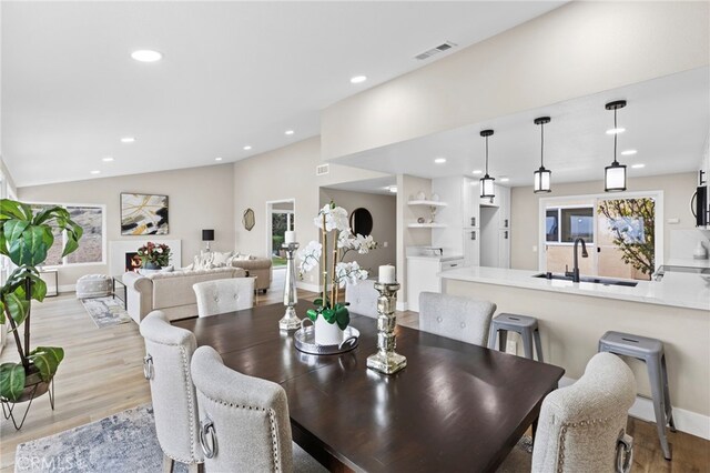 31002 Flying Cloud Dr, Laguna Niguel, CA 92677 - dining space with light wood-style floors, recessed lighting, and vaulted ceiling