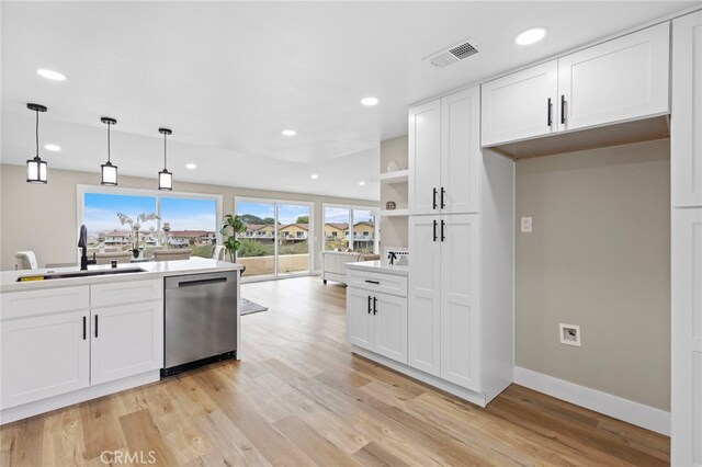 31002 Flying Cloud Dr, Laguna Niguel, CA 92677 - kitchen with dishwasher, open shelves, recessed lighting, light wood-style floors, and white cabinetry