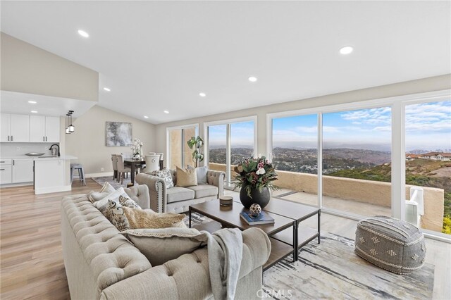 31002 Flying Cloud Dr, Laguna Niguel, CA 92677 - living area with vaulted ceiling, light wood-style flooring, and recessed lighting