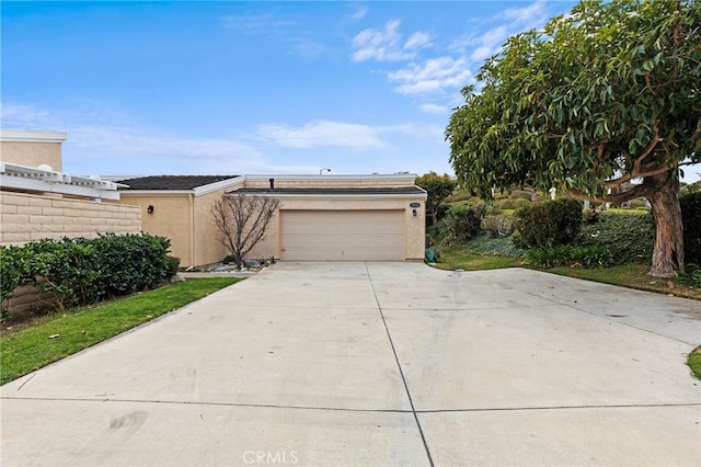 ranch-style home featuring a garage