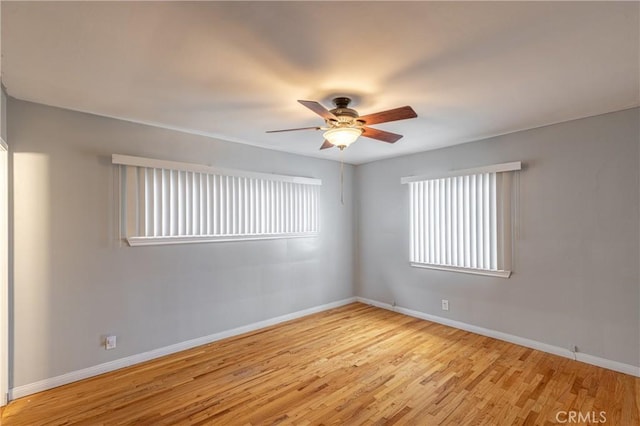 unfurnished room featuring ceiling fan and light wood-type flooring