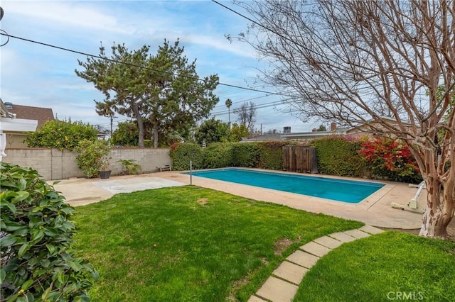 view of pool with a yard and a patio area