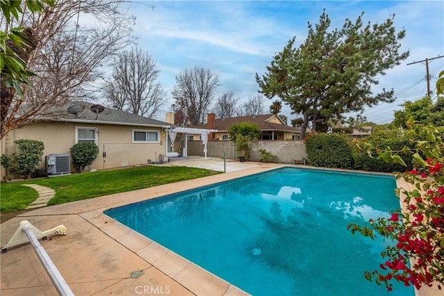 view of pool with a yard, a pergola, and a patio area