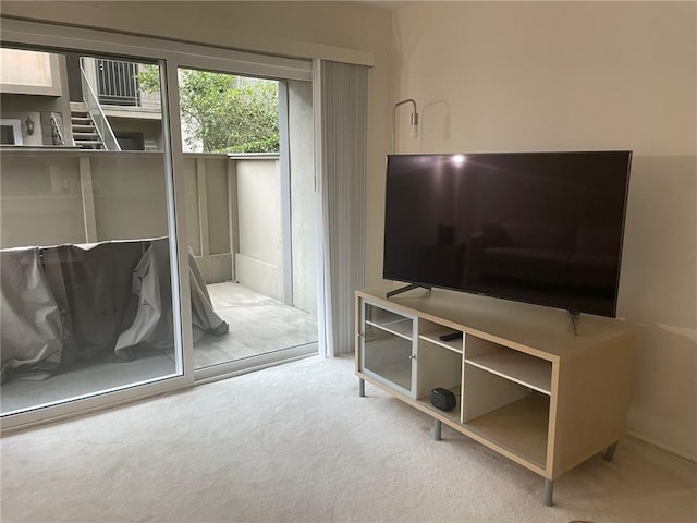 living area with light colored carpet