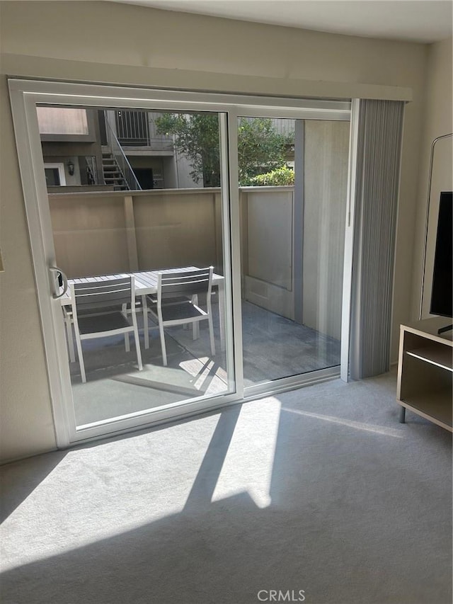 doorway featuring carpet